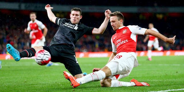 LONDON, ENGLAND - AUGUST 24: Nacho Monreal of Arsenal is closed down by James Milner of Liverpool during the Barclays Premier League match between Arsenal and Liverpool at Emirates Stadium on August 24, 2015 in London, England. (Photo by Clive Mason/Getty Images)