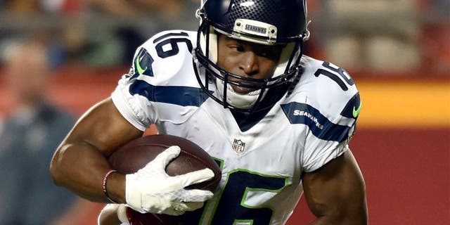 KANSAS CITY, MO - AUGUST 21: Wide receiver Tyler Lockett #16 of the Seattle Seahawks is tackled by cornerback Steven Nelson #20 of the Kansas City Chiefs defends during the preseason game at Arrowhead Stadium on August 21, 2015 in Kansas City, Missouri. (Photo by Peter Aiken/Getty Images)