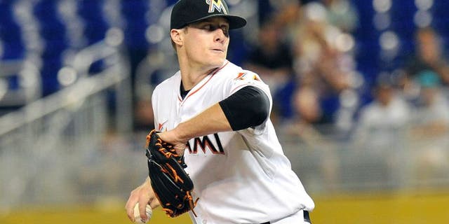 Aug 24, 2015; Miami, FL, USA; Miami Marlins starting pitcher Tom Koehler (34) delivers a pitch against the Pittsburgh Pirates during the first inning at Marlins Park. Mandatory Credit: Steve Mitchell-USA TODAY Sports
