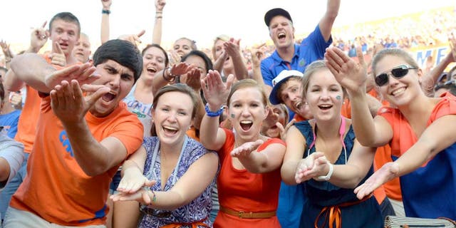 Oct 6, 2012; Gainesville, FL, USA; Florida Gators fans do the gator chomp during the fourth quarter against the LSU Tigers at Ben Hill Griffin Stadium. Mandatory Credit: Jake Roth-USA TODAY Sports