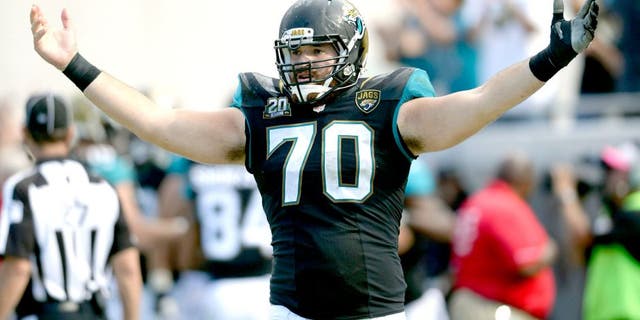 Oct 19, 2014; Jacksonville, FL, USA; Jacksonville Jaguars center Luke Bowanko (70) celebrates after a Jaguars touchdown agains the Cleveland Browns at EverBank Field. Mandatory Credit: Richard Dole-USA TODAY Sports