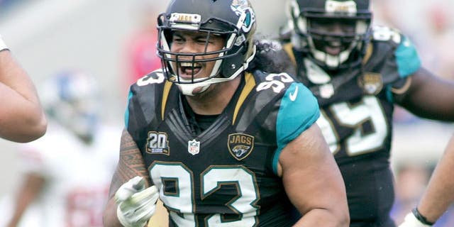 Nov 30, 2014; Jacksonville, FL, USA; Jacksonville Jaguars defensive end Tyson Alualu (93) reacts after a sack agains the New York Giants in the fourth quarter at EverBank Field. The Jaguars won 25-24. Mandatory Credit: Phil Sears-USA TODAY Sports