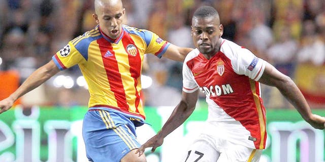 Valencia's French midfielder Sofiane Feghouli (L) vies with Monaco's Portuguese forward Ivan Cavaleiro (R) during the UEFA Champions League playoff football match between AS Monaco FC vs Valencia CF, at the Louis II Stadium, in Monaco, on August 25, 2015 . AFP PHOTO / JEAN CHRISTOPHE MAGNENET (Photo credit should read JEAN CHRISTOPHE MAGNENET/AFP/Getty Images)