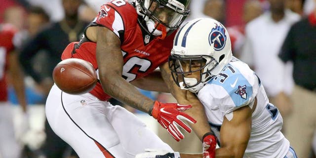 Aug 14, 2015; Atlanta, GA, USA; Tennessee Titans cornerback Cody Riggs (37) breaks up a pass intended for Atlanta Falcons wide receiver Justin Hardy (16) in the third quarter of their preseason NFL football game at Georgia Dome. Mandatory Credit: Jason Getz-USA TODAY Sports