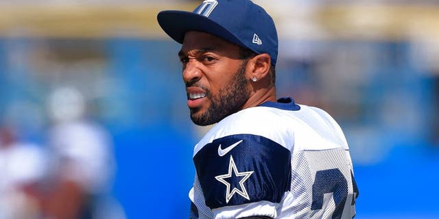 FILE - In this Aug. 18, 2015, file photo, Dallas Cowboys cornerback Orlando Scandrick walks onto the field during a joint NFL football training camp with the St. Louis Rams in Oxnard, Calif. Scandrick left practice at training camp with what he told his secondary coach he believed was a torn anterior cruciate ligament in his right knee. Scandrick went down working against rookie receiver Lucky Whitehead on Tuesday, Aug. 25, and was carted off the field. The Cowboys were awaiting results of an MRI. (AP Photo/Mark J. Terrill, File)