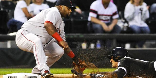 Aug 25, 2015; Chicago, IL, USA; Chicago White Sox center fielder Trayce Thompson (28) triples under Boston Red Sox third baseman Pablo Sandoval (48) during the second inning at U.S Cellular Field. Mandatory Credit: Matt Marton-USA TODAY Sports