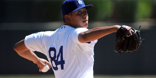 GLENDALE, AZ - MARCH 15: Julio Urias #84 of the Los Angeles Dodgers pitches against the San Diego Padres at Camelback Ranch on March 15, 2014 in Glendale, Arizona. (Photo by Lisa Blumenfeld/Getty Images)
