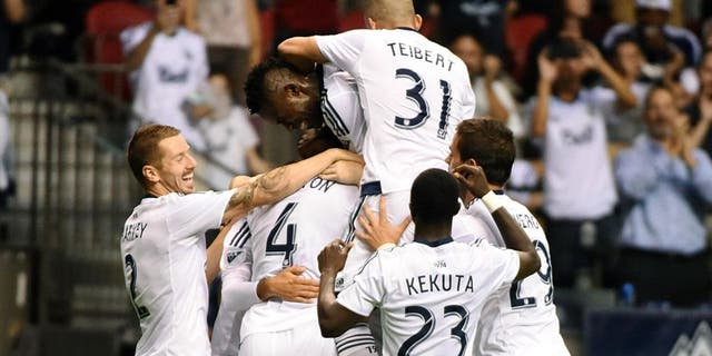 Aug 26, 2015; Vancouver, British Columbia, Canada; Vancouver Whitecaps defender Tim Parker (26) celebrates his goal against Montreal Impact goalkeeper Eric Kronberg (not pictured) during the second half at BC Place. The Vancouver Whitecaps won 2-0. Mandatory Credit: Anne-Marie Sorvin-USA TODAY Sports