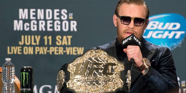 LAS VEGAS, NV - JULY 11: UFC interim featherweight champion Conor McGregor interacts with the media during the UFC 189 post fight press conference at the MGM Grand Garden Arena on July 11, 2015 in Las Vegas, Nevada. (Photo by Jeff Bottari/Zuffa LLC/Zuffa LLC via Getty Images)