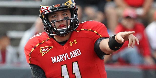October 6, 2012; College Park, MD, USA; Maryland Terrapins quarterback Perry Hills (11) directs the offense against the Wake Forest Demon Deacons at Byrd Stadium. Mandatory Credit: Mitch Stringer-USA TODAY Sports
