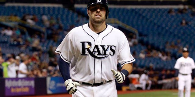 Aug 25, 2015; St. Petersburg, FL, USA; Tampa Bay Rays catcher Curt Casali (19) scores a run during the sixth inning against the against the Minnesota Twins at Tropicana Field. Mandatory Credit: Kim Klement-USA TODAY Sports