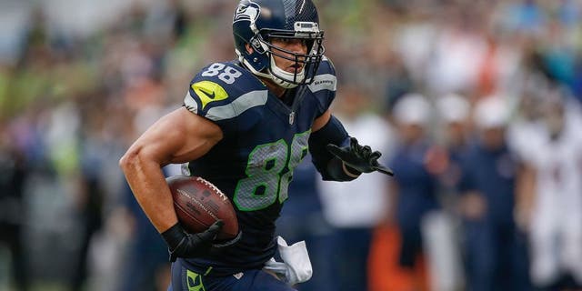 SEATTLE, WA - AUGUST 14: Tight end Jimmy Graham #88 of the Seattle Seahawks rushes against the Denver Broncos at CenturyLink Field on August 14, 2015 in Seattle, Washington. (Photo by Otto Greule Jr/Getty Images)