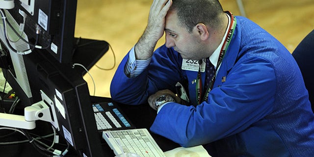 Aug. 19: Bank of America Specialist Peter Giacchi reacts on the floor of the New York Stock Exchange.