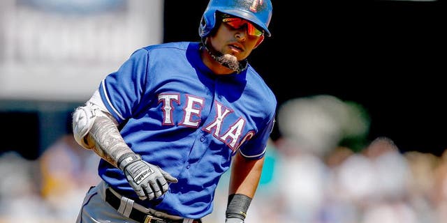 SEATTLE, WA - AUGUST 27: Rougned Odor #12 of the Texas Rangers rounds the bases after hitting a grand slam in the third inning against the Seattle Mariners at Safeco Field on August 27, 2014 in Seattle, Washington. The Rangers defeated the Mariners 12-4. (Photo by Otto Greule Jr/Getty Images)