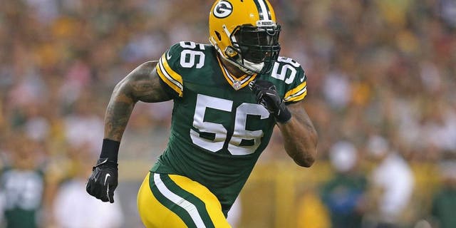 GREEN BAY, WI - AUGUST 22: Julius Peppers #56 of the Green Bay Packers rushes against the Oakland Raiders during a preseason game at Lambeau Field on August 22, 2014 in Green Bay, Wisconsin. The Packers defeated the Raiders 31-21. (Photo by Jonathan Daniel/Getty Images) *** Local Caption *** Julius Peppers