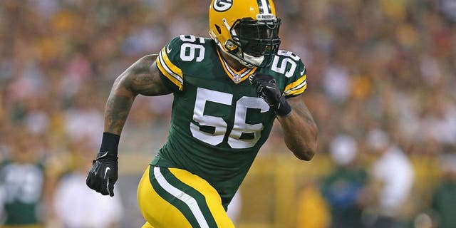 GREEN BAY, WI - AUGUST 22: Julius Peppers #56 of the Green Bay Packers rushes against the Oakland Raiders during a preseason game at Lambeau Field on August 22, 2014 in Green Bay, Wisconsin. The Packers defeated the Raiders 31-21. (Photo by Jonathan Daniel/Getty Images) *** Local Caption *** Julius Peppers
