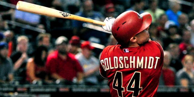 Aug 26, 2015; Phoenix, AZ, USA; Arizona Diamondbacks first baseman Paul Goldschmidt (44) hits a solo home run during the first inning against the St. Louis Cardinals at Chase Field. Mandatory Credit: Matt Kartozian-USA TODAY Sports