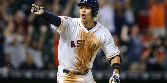 Aug 19, 2015; Houston, TX, USA; Houston Astros shortstop Carlos Correa (1) gets a walk off game-winning RBI single during the thirteenth inning as the Astros defeated the Tampa Bay Rays 3-2 at Minute Maid Park. Mandatory Credit: Troy Taormina-USA TODAY Sports