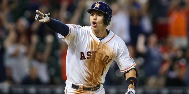 Aug 19, 2015; Houston, TX, USA; Houston Astros shortstop Carlos Correa (1) gets a walk off game-winning RBI single during the thirteenth inning as the Astros defeated the Tampa Bay Rays 3-2 at Minute Maid Park. Mandatory Credit: Troy Taormina-USA TODAY Sports