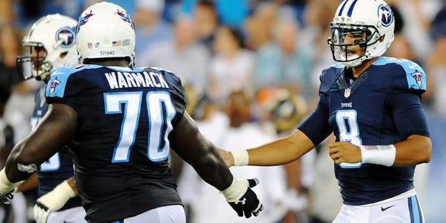 Aug 23, 2015; Nashville, TN, USA; Tennessee Titans quarterback Marcus Mariota (8) is congratulated by guard Chance Warmack (70) after completing a first down during the first half against the St. Louis Rams at Nissan Stadium. Mandatory Credit: Christopher Hanewinckel-USA TODAY Sports