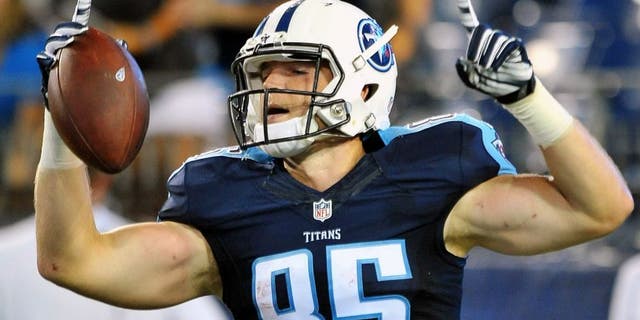 Aug 23, 2015; Nashville, TN, USA; Tennessee Titans tight end Chase Coffman (85) celebrates scoring a touchdown after catching a pass from Titans quarterback Alex Tanney (not pictured) during the second half at Nissan Stadium. Titans won 27-14. Mandatory Credit: Jim Brown-USA TODAY Sports