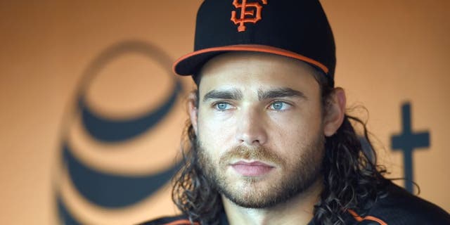 SAN FRANCISCO, CA - AUGUST 25: Brandon Crawford #35 of the San Francisco Giants looks on from the dugout during batting practice prior to playing the Chicago Cubs at AT&T Park on August 25, 2015 in San Francisco, California. (Photo by Thearon W. Henderson/Getty Images)