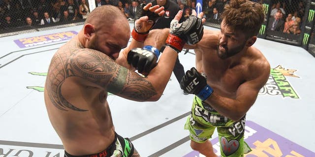 LAS VEGAS, NV - MAY 23: (R-L) Andrei Arlovski punches Travis Browne in their heavyweight bout during the UFC 187 event at the MGM Grand Garden Arena on May 23, 2015 in Las Vegas, Nevada. (Photo by Josh Hedges/Zuffa LLC/Zuffa LLC via Getty Images)