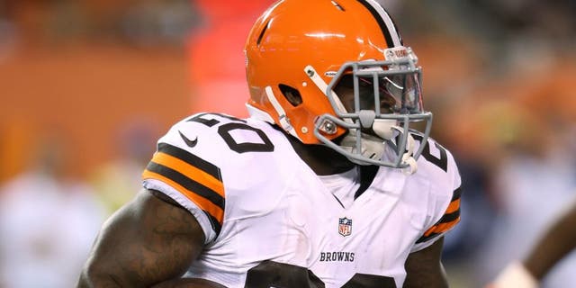 Aug 28, 2014; Cleveland, OH, USA; Cleveland Browns running back Terrance West (20) runs against Chicago Bears during the second quarter at FirstEnergy Stadium. Mandatory Credit: Ron Schwane-USA TODAY Sports