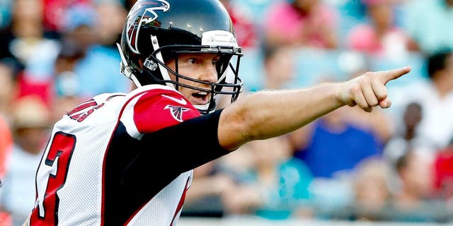 JACKSONVILLE, FL - AUGUST 28: T.J. Yates #13 of the Atlanta Falcons points during the preseason NFL game against the Jacksonville Jaguars at EverBank Field on August 28, 2014 in Jacksonville, Florida. (Photo by Sam Greenwood/Getty Images)