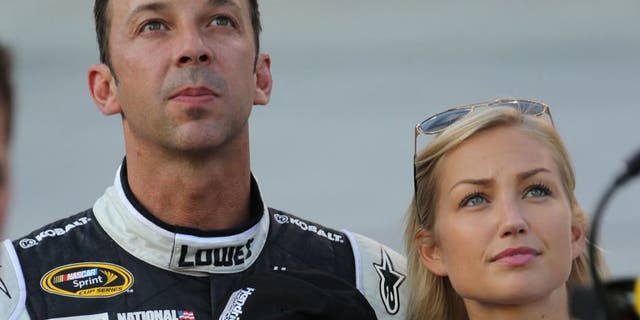 USA -Aug 23: NASCAR Sprint Cup Series crew chief Chad Knaus and his girlfriend Brooke Werner stand on pit road during the National Anthem prior to the start of the NASCAR Sprint Cup Series Irwin Tools Night Race at the Bristol Motor Speedway in Bristol, TN. Picture taken on Aug 23, 2014 in the United States. (Photo by Jim Fluharty/NASCAR Illustrated/Sporting News via Getty Images)