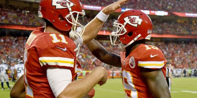 Aug 21, 2015; Kansas City, MO, USA; Kansas City Chiefs wide receiver Jeremy Maclin (19) celebrates with quarterback Alex Smith (11) after catching a touchdown pass against the Seattle Seahawks in the first half at Arrowhead Stadium. Mandatory Credit: John Rieger-USA TODAY Sports