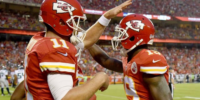 Aug 21, 2015; Kansas City, MO, USA; Kansas City Chiefs wide receiver Jeremy Maclin (19) celebrates with quarterback Alex Smith (11) after catching a touchdown pass against the Seattle Seahawks in the first half at Arrowhead Stadium. Mandatory Credit: John Rieger-USA TODAY Sports