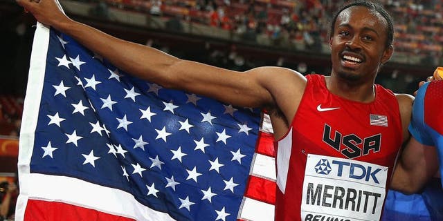 BEIJING, CHINA - AUGUST 28: Gold medalist Sergey Shubenkov of Russia (C) celebrates with bronze medalist Aries Merritt of the United States (L) and silver medalist Hansle Parchment of Jamaica after the Men's 110 metres hurdles final during day seven of the 15th IAAF World Athletics Championships Beijing 2015 at Beijing National Stadium on August 28, 2015 in Beijing, China. (Photo by Ian Walton/Getty Images)