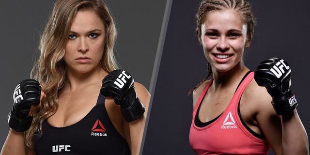 UFC women's bantamweight champion Ronda Rousey poses for a portrait during a UFC photo session at the Sheraton Rio Hotel on July 28, 2015 in Rio de Janeiro, Brazil. (Photo by Jeff Bottari/Zuffa LLC/Zuffa LLC via Getty Images) Paige VanZant poses for a portrait after defeating Felice Herrig in their women's strawweight bout during the UFC Fight Night event at Prudential Center on April 18, 2015 in Newark, New Jersey. (Photo by Mike Roach/Zuffa LLC/Zuffa LLC via Getty Images)