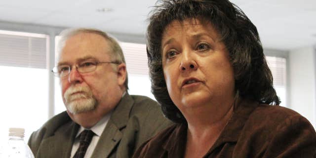 July 16, 2011: Secretary of State Dianna Duran, right, talks about her office's efforts to ensure the accuracy of the state's voter registration rolls during an interim legislative committee hearing in Albuquerque, N.M.