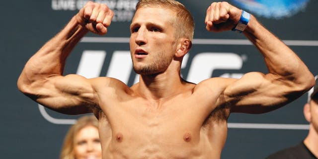 SACRAMENTO, CA - AUGUST 29: UFC bantamweight champion T.J. Dillashaw weighs in during the UFC 177 weigh-in at Sleep Train Arena on August 29, 2014 in Sacramento, California. (Photo by Josh Hedges/Zuffa LLC/Zuffa LLC via Getty Images)