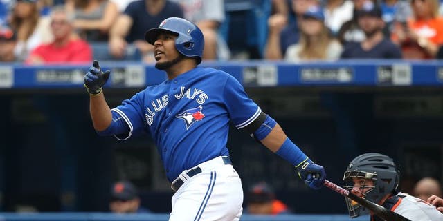 TORONTO, CANADA - AUGUST 29: Edwin Encarnacion #10 of the Toronto Blue Jays hits a three-run home run in the first inning during MLB game action against the Detroit Tigers on August 29, 2015 at Rogers Centre in Toronto, Ontario, Canada. (Photo by Tom Szczerbowski/Getty Images)