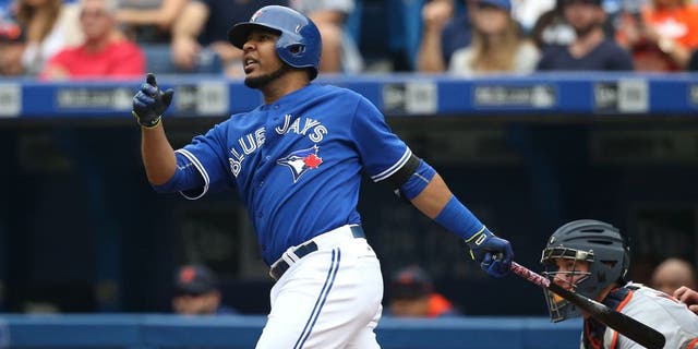 TORONTO, CANADA - AUGUST 29: Edwin Encarnacion #10 of the Toronto Blue Jays hits a three-run home run in the first inning during MLB game action against the Detroit Tigers on August 29, 2015 at Rogers Centre in Toronto, Ontario, Canada. (Photo by Tom Szczerbowski/Getty Images)