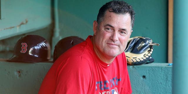 BOSTON, MA - AUGUST 19: John Farrell #53 of the Boston Red Sox makes a visit to the dugout before a game against the Cleveland Indians at Fenway Park on August 19, 2015 in Boston, Massachusetts. Last week, Farrell relinquished his duties as manager to undergo treatment for lymphoma. (Photo by Jim Rogash/Getty Images)