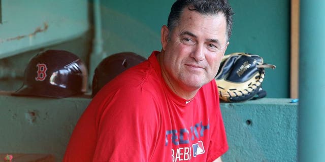 BOSTON, MA - AUGUST 19: John Farrell #53 of the Boston Red Sox makes a visit to the dugout before a game against the Cleveland Indians at Fenway Park on August 19, 2015 in Boston, Massachusetts. Last week, Farrell relinquished his duties as manager to undergo treatment for lymphoma. (Photo by Jim Rogash/Getty Images)