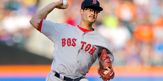 NEW YORK, NY - AUGUST 29: Joe Kelly #56 of the Boston Red Sox pitches in the third inning against the New York Mets at Citi Field on August 29, 2015 in the Flushing neighborhood of the Queens borough of New York City. (Photo by Jim McIsaac/Getty Images)