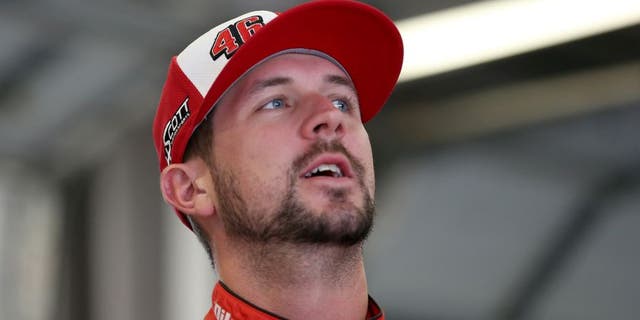 SPARTA, KY - JULY 10: Michael Annett, driver of the #46 Pilot/Flying J Chevrolet, looks on from the garage area during a rain delay in practice for the NASCAR Sprint Cup Series Quaker State 400 Presented by Advance Auto Parts at Kentucky Speedway on July 10, 2015 in Sparta, Kentucky. (Photo by Todd Warshaw/Getty Images)