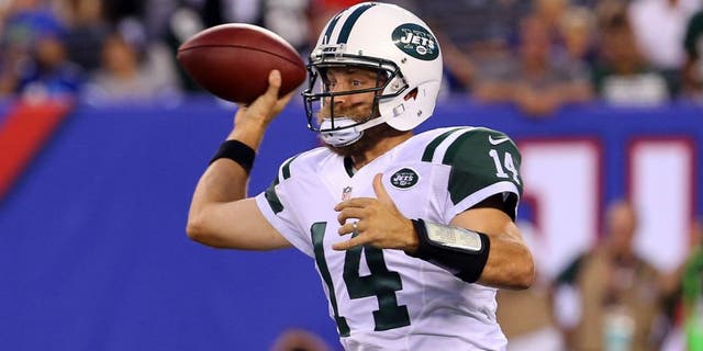 Aug 29, 2015; East Rutherford, NJ, USA; New York Jets quarterback Ryan Fitzpatrick (14) throws a pass during the first half of their game against the New York Giants at MetLife Stadium. Mandatory Credit: Ed Mulholland-USA TODAY Sports