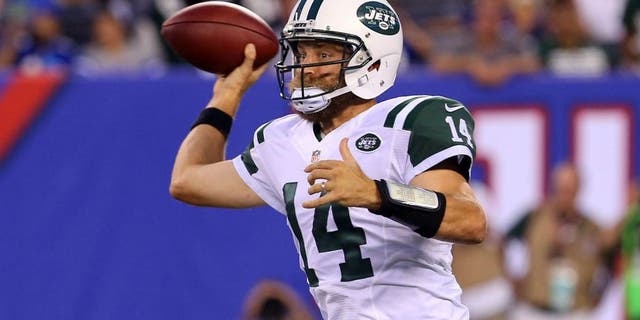 Aug 29, 2015; East Rutherford, NJ, USA; New York Jets quarterback Ryan Fitzpatrick (14) throws a pass during the first half of their game against the New York Giants at MetLife Stadium. Mandatory Credit: Ed Mulholland-USA TODAY Sports