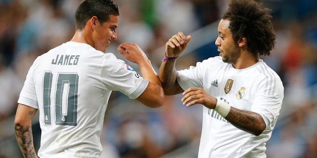 MADRID, SPAIN - AUGUST 18: Marcelo (R) and James Rodriguez of Real Madrid celebrate after scoring during the Santiago Bernabeu Trophy match between Real Madrid and Galatasaray at Estadio Santiago Bernabeu on August 18, 2015 in Madrid, Spain. (Photo by Helios de la Rubia/Real Madrid via Getty Images)