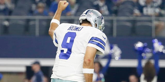 Dallas Cowboys quarterback Tony Romo (9) celebrates his touchdown pass against the Minnesota Vikings during the first half of a preseason NFL football game Saturday, Aug. 29, 2015, in Arlington, Texas. (AP Photo/Tony Gutierrez)