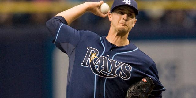 Tampa Bay Rays starter Jake Odorizzi pitches against the Kansas City Royals during the first inning of a baseball game Saturday, Aug. 29, 2015, in St. Petersburg, Fla. (AP Photo/Steve Nesius)