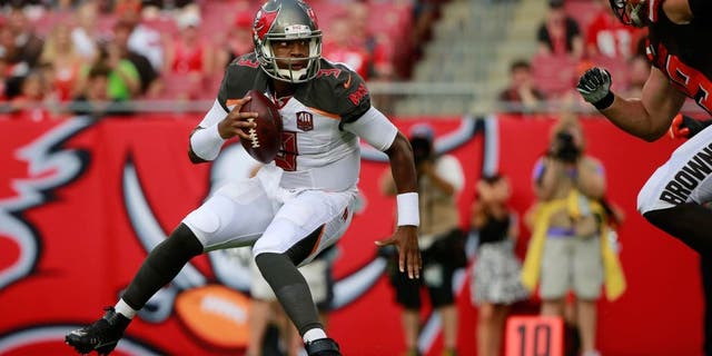 Aug 29, 2015; Tampa, FL, USA; Tampa Bay Buccaneers quarterback Jameis Winston (3) gets pressured against the Cleveland Browns during the first quarter at Raymond James Stadium. Mandatory Credit: Kim Klement-USA TODAY Sports