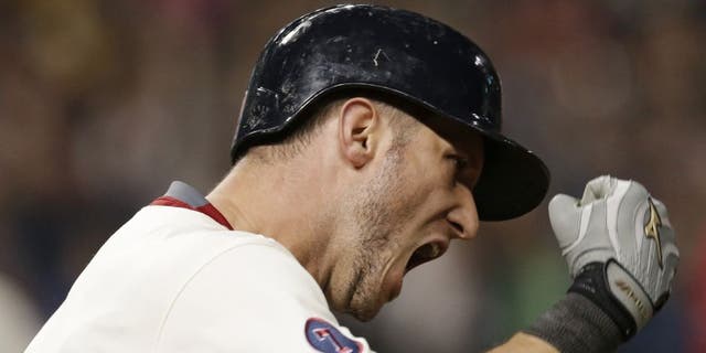 Cleveland Indians' Yan Gomes reacts after hitting a grand slam off Los Angeles Angels relief pitcher Joe Smith