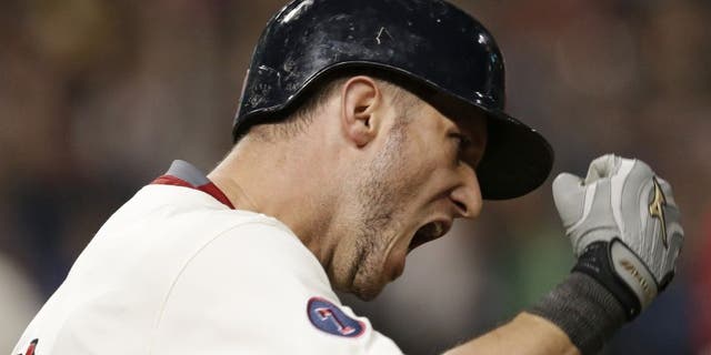 Cleveland Indians' Yan Gomes reacts after hitting a grand slam off Los Angeles Angels relief pitcher Joe Smith